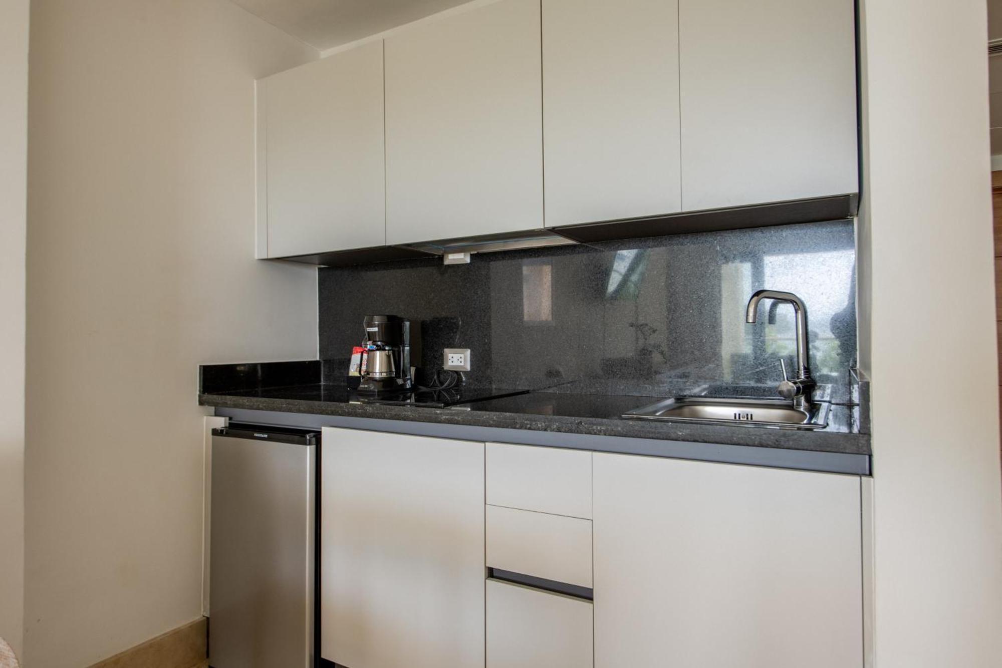 Hacienda Samana Bay Hotel Exterior photo A typical kitchen in a student apartment
